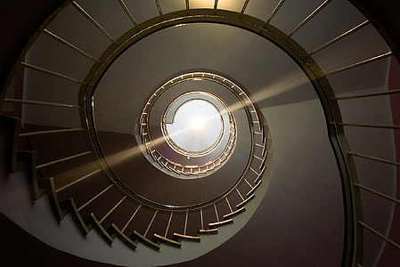 architectural photography of spiral stairs thumbnail