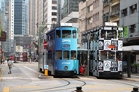 two parked cable double decker buses near building thumbnail