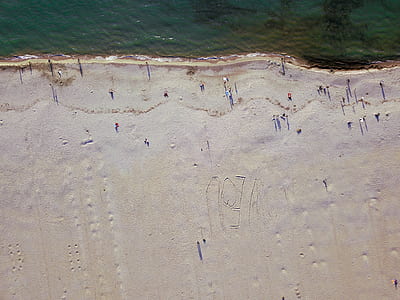aerial photo of people on seashore thumbnail