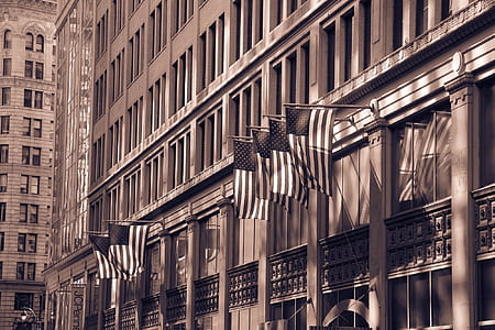 USA flags on outdoor wall building thumbnail