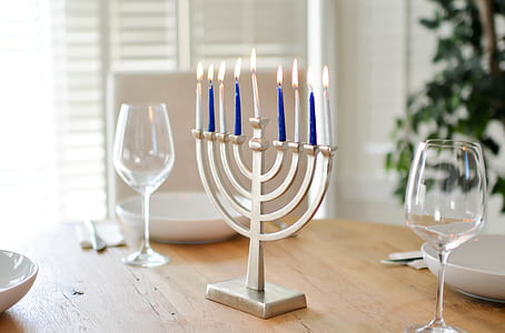 Stainless Steel Candelabra Beside Clear Wine Glasses thumbnail