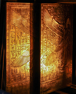 pair of brown wooden boards with ancient carvings thumbnail
