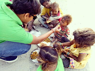 man feeding children thumbnail