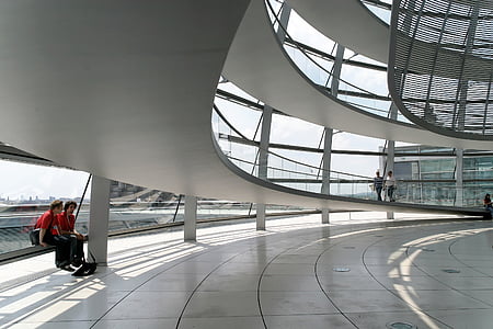 architectural photography of spiral stairs inside building thumbnail