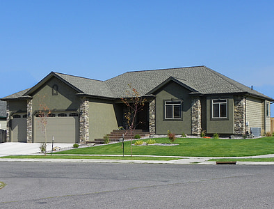 photo of grey house on green grass field thumbnail