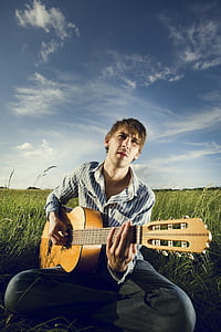 men's blue and white pinstripe dress shirt playing classical guitar thumbnail