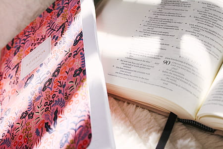 bible on top of beige mat thumbnail