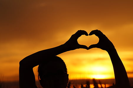 silhouette of heart sign during sunset thumbnail