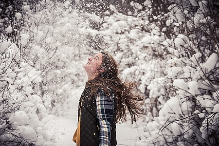 woman standing in forest trees thumbnail