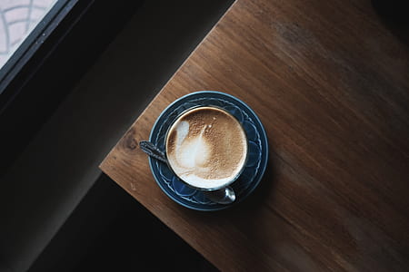 top view photo of mug with coffee art thumbnail