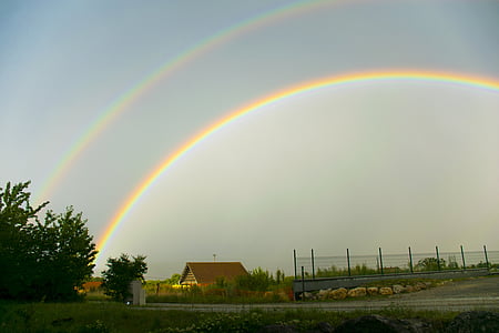 rainbow over house landscape photo thumbnail