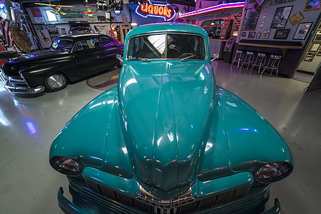 classic teal vehicle inside museum thumbnail