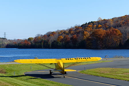 A Piper Cub single engine private airplane taxiing to ready for a takepoff from a local airport. thumbnail