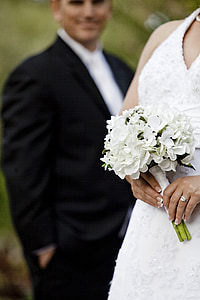 woman holding white hydrangea flower bouquet thumbnail