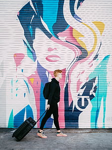 person walking holding luggage bag thumbnail