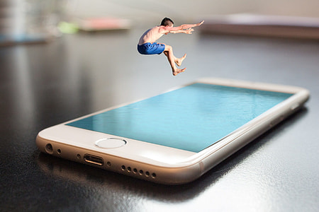 silver iPhone 6 on black table thumbnail