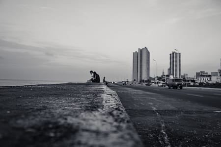 grayscale photo of couple on bay walk thumbnail