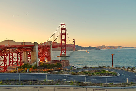 Golden Bridge during sunset over the body of water thumbnail