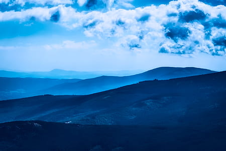 mountain and clouds during daytime thumbnail
