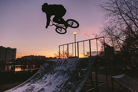 man riding on bike silhouette thumbnail
