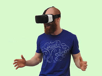 man using black and white Oculus VR goggles thumbnail