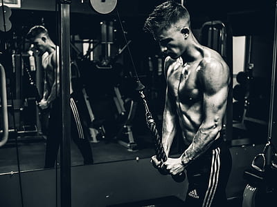 man pulling exercise machine cable thumbnail