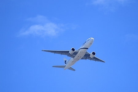 white and blue airplane at the sky during daytime thumbnail