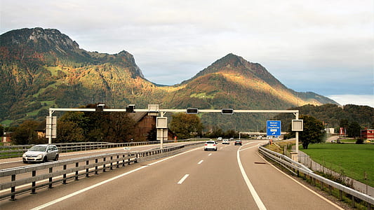 road nearby brown mountains thumbnail
