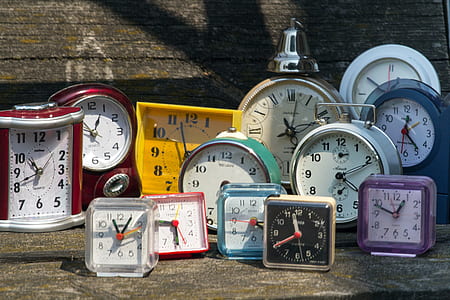 analog clocks on wooden surface thumbnail