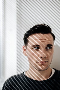 man wearing black crew-neck shirt thumbnail