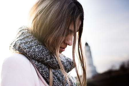 close-up photography woman wearing gray knitted scarf thumbnail