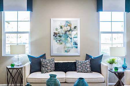 white suede 2-seat sofa with four throw pillows thumbnail