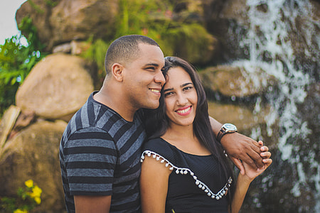 shallow focus photography of woman and man holding hands thumbnail