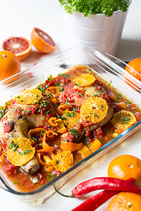 Chicken legs with tomatoes, peppers and oranges thumbnail
