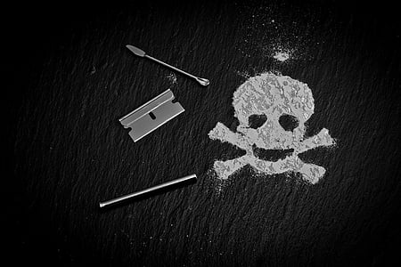 grayscale photography of door latched beside skull powder thumbnail