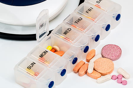 assorted medicine pills in clear medicine organizer thumbnail