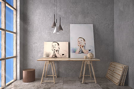 two paintings of boy on top of wooden table thumbnail