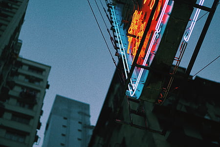 worm's eye view of red and blue LED signage thumbnail