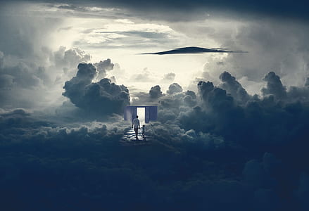person and child beside clouds during daytime thumbnail