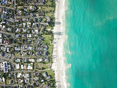 aerial view photography of houses near coastline thumbnail