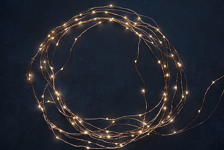 lighted white string lights with black background thumbnail