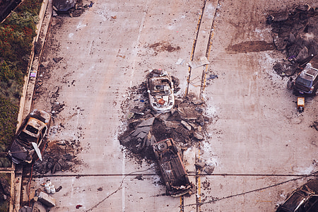 wrecked cars on gray concrete road top during daytime thumbnail
