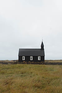 black wooden chapel under gray sky thumbnail