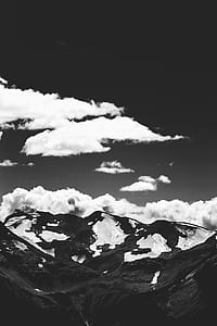 gray scale photography of mountain coated with snow thumbnail