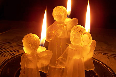macro photography of lighted angel candles thumbnail