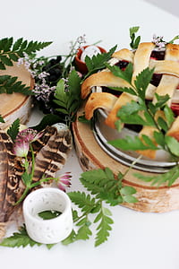 pie with green leaf on tabletop thumbnail