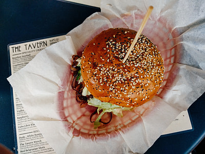 burger with stick on white tissue paper thumbnail