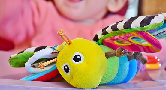 closeup photo of multicolored butterfly plush toy thumbnail