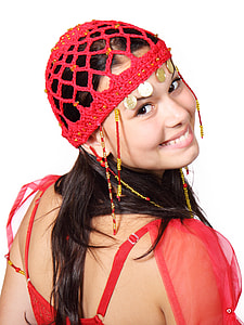 woman in knitted red mesh hat and red sheer top thumbnail
