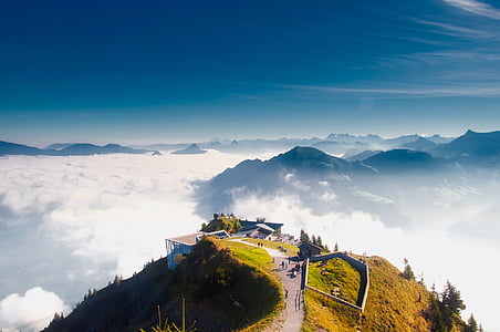 bird eye photography of brown house on mountain thumbnail